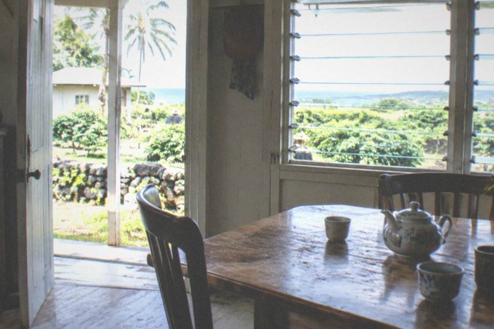 Restored farmhouse interior with period furniture and household items
